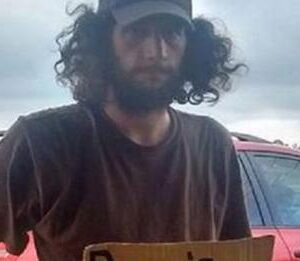 Woman Started To Drive Past Homeless Man, Then Notices His Carboard Sign And She Slams On The Brakes