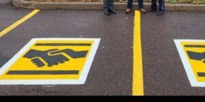 Here’s what a handshake symbol on a parking space means
