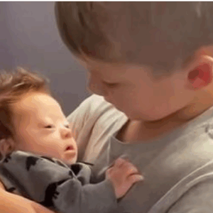 Boy Sings To Infant Brother And Says “Aren’t We All Different