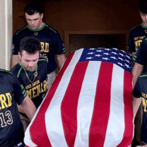 High school seniors carry the casket of Air Force veteran with no family