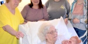 A 98-year-old woman is pictured alongside six generations of her family